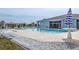 Enjoy the community pool with lounge chairs, umbrellas, and a nearby clubhouse at 6037 Shearwater Dr, Englewood, FL 34224