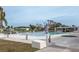 Community pool with ample seating and shaded areas for relaxing and socializing at 6037 Shearwater Dr, Englewood, FL 34224