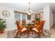 Dining area featuring chandelier and a window at 6037 Shearwater Dr, Englewood, FL 34224