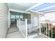 Exterior showcases a covered patio leading to a cozy sunroom at 6037 Shearwater Dr, Englewood, FL 34224