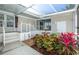 Exterior featuring a patio with fountain and landscaped yard at 6037 Shearwater Dr, Englewood, FL 34224