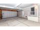 This garage has a garage door and extra storage space at 6037 Shearwater Dr, Englewood, FL 34224
