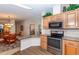 Bright kitchen featuring stainless steel appliances and an opening to the dining area at 6037 Shearwater Dr, Englewood, FL 34224