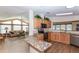 Open concept kitchen with modern appliances, granite countertops, and ample cabinet space at 6037 Shearwater Dr, Englewood, FL 34224