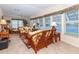 Spacious living room with wicker seating, offering plenty of natural light and views of the outdoors at 6037 Shearwater Dr, Englewood, FL 34224