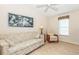 Living room featuring a floral patterned sofa and a window at 6037 Shearwater Dr, Englewood, FL 34224