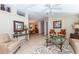 Inviting living room with neutral furniture, decorative art, and tile flooring throughout at 6037 Shearwater Dr, Englewood, FL 34224
