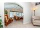 Inviting living room features stylish wicker furniture and neutral tones, creating a relaxing atmosphere at 6037 Shearwater Dr, Englewood, FL 34224