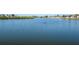 A tranquil water view captures the serene neighborhood landscape at 6037 Shearwater Dr, Englewood, FL 34224