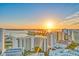 Breathtaking aerial view of a waterfront community at sunset with modern high-rise buildings and tranquil ocean views at 614 N Jefferson Ave # 27, Sarasota, FL 34237