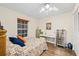 Bedroom with ample natural light, dresser, desk, and closet at 614 N Jefferson Ave # 27, Sarasota, FL 34237