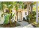 Inviting front entrance with tropical landscaping at 614 N Jefferson Ave # 27, Sarasota, FL 34237