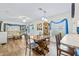 Open-concept living and dining area with wood floors and natural light at 614 N Jefferson Ave # 27, Sarasota, FL 34237