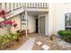 The front entrance is nicely landscaped with flowers and stone at 6157 Midnight Pass Rd # D31, Sarasota, FL 34242