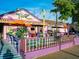 The Fudge Factory, a charming purple building with outdoor seating and vibrant decor at 6157 Midnight Pass Rd # D31, Sarasota, FL 34242