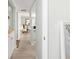 Hallway leading to dining room and kitchen with light paint at 6157 Midnight Pass Rd # D31, Sarasota, FL 34242