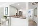 Partial kitchen view, showcasing the breakfast bar, kitchen appliances and open layout at 6157 Midnight Pass Rd # D31, Sarasota, FL 34242
