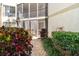Charming patio with lush greenery and views of surrounding condos at 6157 Midnight Pass Rd # D31, Sarasota, FL 34242