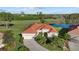 Expansive single-Gathering home boasts tile roof and pristine landscaping on a lush lot with water view at 6210 Cormorant Ct, Bradenton, FL 34203