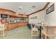 Nicely decorated clubhouse bar area with wooden cabinets at 6210 Cormorant Ct, Bradenton, FL 34203