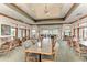 Large, well-lit dining room with multiple tables and chairs and great views of the outdoors at 6210 Cormorant Ct, Bradenton, FL 34203