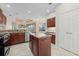 Kitchen includes stainless steel appliances, granite countertops, and a center island with seating at 6210 Cormorant Ct, Bradenton, FL 34203