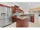 Modern kitchen features stainless steel appliances, granite countertops, and a functional center island at 6210 Cormorant Ct, Bradenton, FL 34203