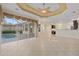 Bright and airy living space features tile flooring and easy access to the outdoor screened-in lanai at 6210 Cormorant Ct, Bradenton, FL 34203