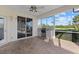 Covered patio area with a built-in grill, brick flooring, and a sliding door entry at 6210 Cormorant Ct, Bradenton, FL 34203