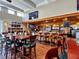 Clubhouse bar area with ample seating and multiple televisions for entertainment at 651 Back Nine Dr, Venice, FL 34285