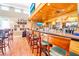 Well-stocked bar area with wood accents and comfortable seating in the community clubhouse at 651 Back Nine Dr, Venice, FL 34285