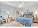 Comfortable bedroom with shuttered windows and beach-themed decor at 651 Back Nine Dr, Venice, FL 34285