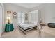 Bright bedroom with a Murphy bed open to a bed, desk, ceiling fan, and window at 651 Back Nine Dr, Venice, FL 34285