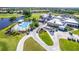 Aerial view of community center with swimming pool and golf cart parking at 651 Back Nine Dr, Venice, FL 34285