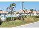 Enjoy the Florida sunshine poolside, surrounded by lush landscaping and palm trees at 651 Back Nine Dr, Venice, FL 34285