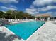 Community pool area featuring inviting blue water and lounge chairs at 651 Back Nine Dr, Venice, FL 34285