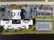 Aerial view of condo complex with parking, tennis court and access to the water at 66 Boundary Blvd # 275, Rotonda West, FL 33947