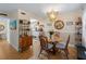 Bright dining area with chandelier and seating for four at 66 Boundary Blvd # 275, Rotonda West, FL 33947