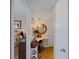Hallway view of bedroom and vanity area with herringbone wood flooring at 66 Boundary Blvd # 275, Rotonda West, FL 33947