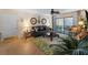 Comfortable living room featuring sliding glass doors to a lanai and herringbone floors at 66 Boundary Blvd # 275, Rotonda West, FL 33947