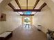 Arched room with view of the water, table and chairs, ceiling detail, and neutral paint at 66 Boundary Blvd # 275, Rotonda West, FL 33947