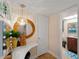 Makeup vanity area with ample natural light and herringbone wood flooring at 66 Boundary Blvd # 275, Rotonda West, FL 33947