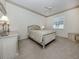 Bedroom with neutral tones, a ceiling fan, crown molding, and comfortable furnishings at 692 Egret Walk Ln, Venice, FL 34292