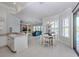 An open-concept home featuring a seamless transition to the dining and kitchen areas at 692 Egret Walk Ln, Venice, FL 34292