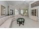 Spacious living room with dining area featuring tile floors, crown moulding and lots of natural light at 692 Egret Walk Ln, Venice, FL 34292