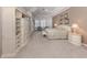 Spacious primary bedroom with an ensuite bathroom and tray ceilings at 692 Egret Walk Ln, Venice, FL 34292