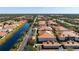 Beautiful aerial view of the neighborhood with red roofs and scenic water views at 7104 L Pavia Blvd # 7104, Venice, FL 34292