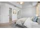 Bright bedroom features vaulted ceiling, neutral carpet, bathroom and walk-in closet access at 7104 L Pavia Blvd # 7104, Venice, FL 34292