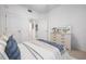 Bedroom features a bed, large window, and furniture at 7104 L Pavia Blvd # 7104, Venice, FL 34292