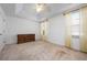 Bright bedroom features vaulted ceiling, large window, neutral carpet and a dresser at 7104 L Pavia Blvd # 7104, Venice, FL 34292